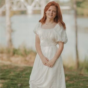 “✨ Timeless Elegance in White ✨ This stunning white boutique dress is perfect!